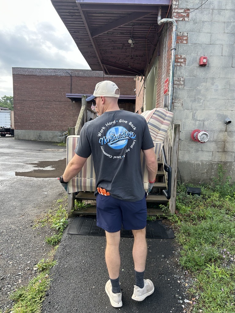 northeastern insurance volunteers at restore program
