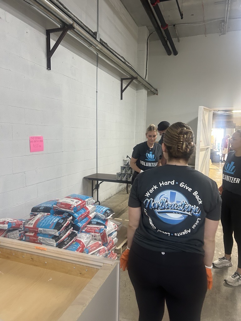 northeastern insurance volunteers at habitat for humanity restore program