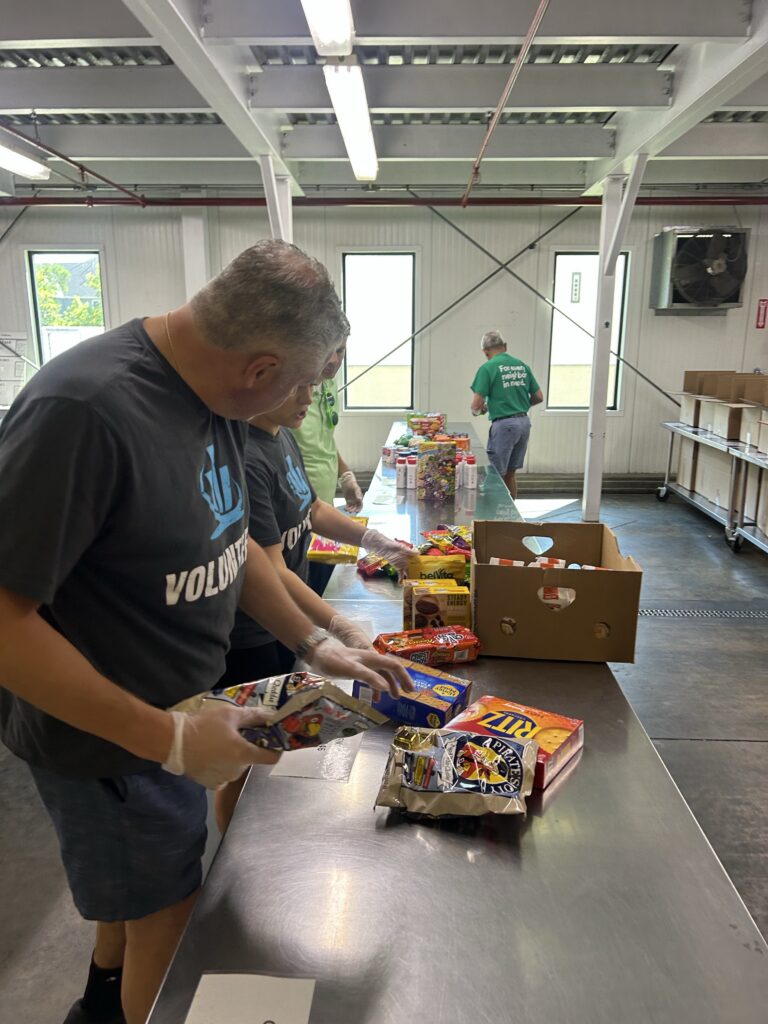 northeastern insurance volunteers at the regional food bank in latham, ny