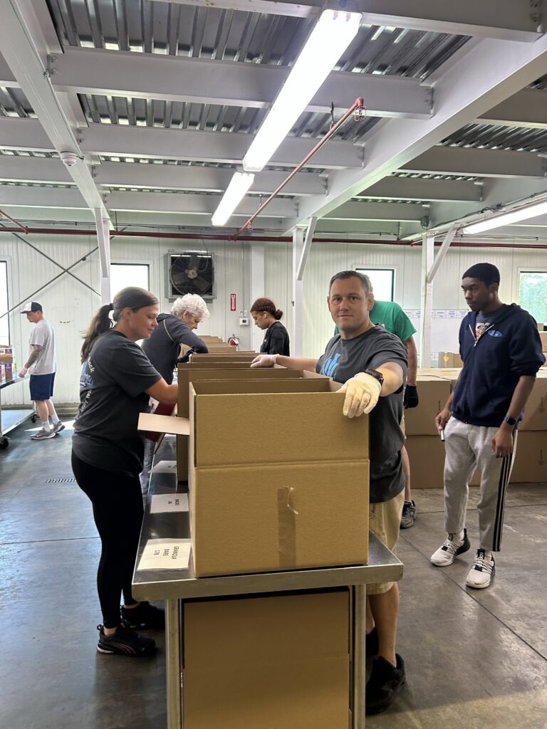 northeastern insurance volunteers at the regional food bank in latham, ny