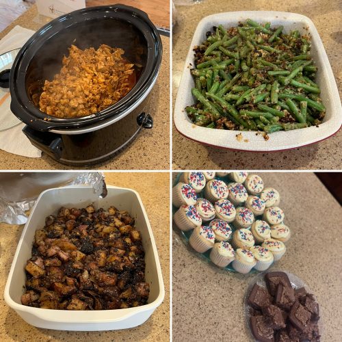 A variety of home-cooked dishes and desserts served in bowls and trays.
